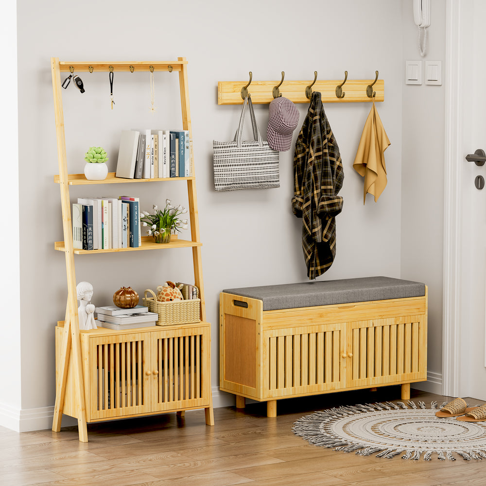 A stylish wooden shelf with plants, a radio, photos, and decor, featuring a lower cabinet with slatted doors beside a sunny window.