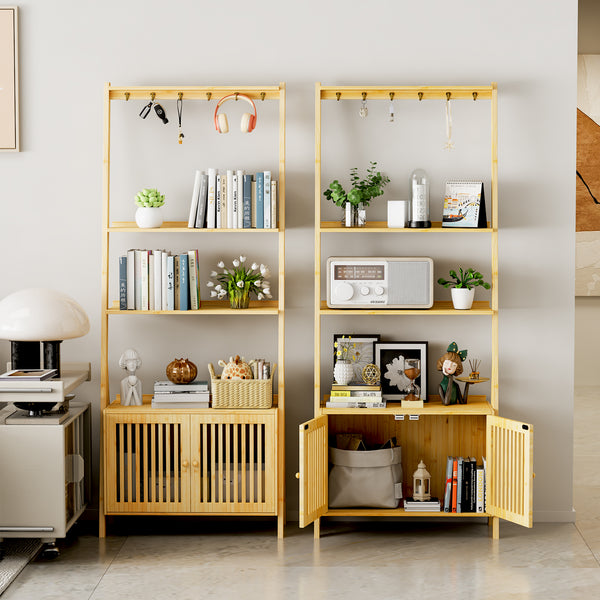 A stylish room features two wooden bookshelves filled with books, plants, decor, and a radio, alongside a sleek lamp and cabinet.