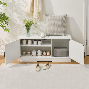 A stylish entryway scene featuring a white shoe cabinet, arranged shoes, a vase of flowers, and a soft rug. Cozy and inviting atmosphere.