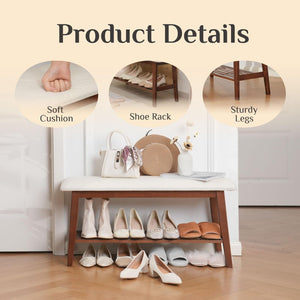 Image of a stylish bench with a soft cushion, shoe rack, and sturdy legs, showcasing various pairs of shoes and accessories.