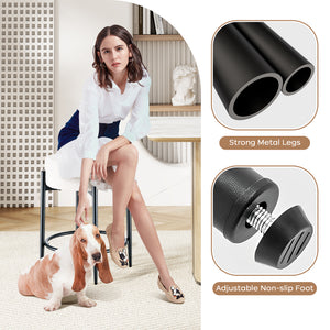 A stylish woman in a white blouse and skirt sits on a stool beside a basset hound, showcasing modern design elements and furniture details.