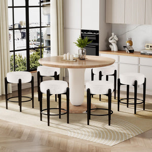 Modern dining area featuring a round wooden table surrounded by six white and black upholstered bar stools, with a large window view.