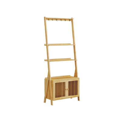 A stylish wooden ladder shelf with two shelves, a cabinet with slatted doors, and hooks at the top for hanging items.